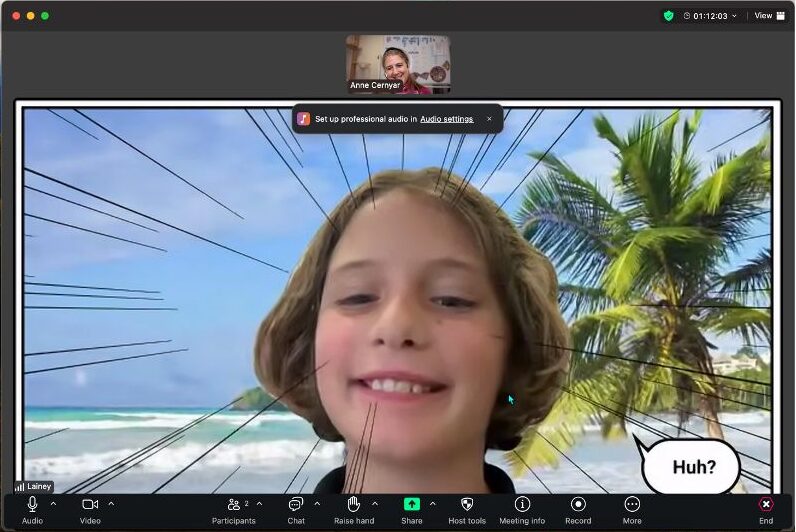 A child smiles with a beach background during a video call, featuring comic-style effects and a speech bubble asking, "Huh?"